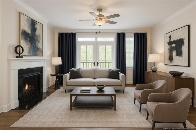 234 Hugh Shelton Loop, Fayetteville, NC 28301 - living room featuring ceiling fan, crown molding, wood finished floors, a warm lit fireplace, and baseboards