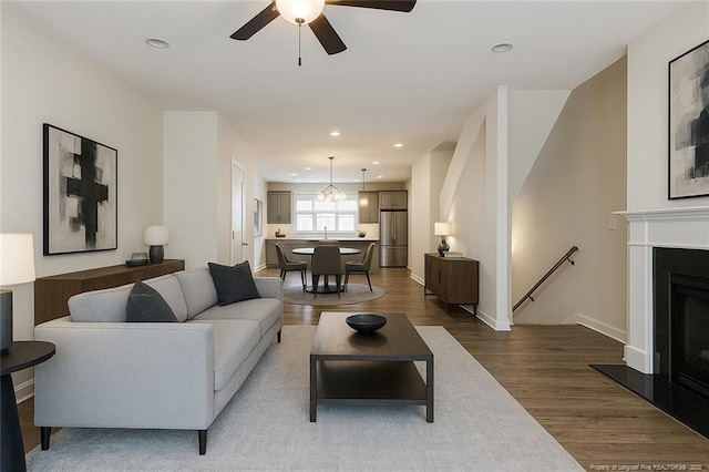 234 Hugh Shelton Loop, Fayetteville, NC 28301 - living room with dark wood-style floors, ceiling fan, recessed lighting, baseboards, and a fireplace with raised hearth