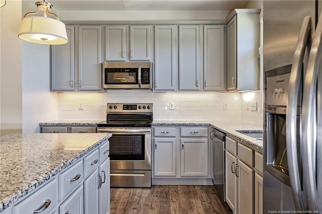 234 Hugh Shelton Loop, Fayetteville, NC 28301 - kitchen with appliances with stainless steel finishes, gray cabinetry, light stone counters, and backsplash