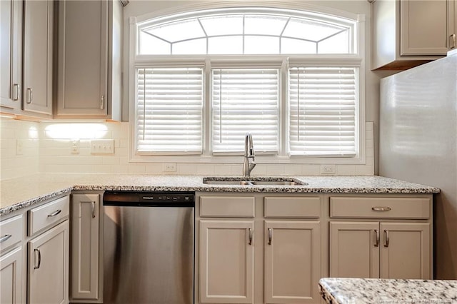 234 Hugh Shelton Loop, Fayetteville, NC 28301 - kitchen featuring dishwasher, a sink, freestanding refrigerator, and plenty of natural light