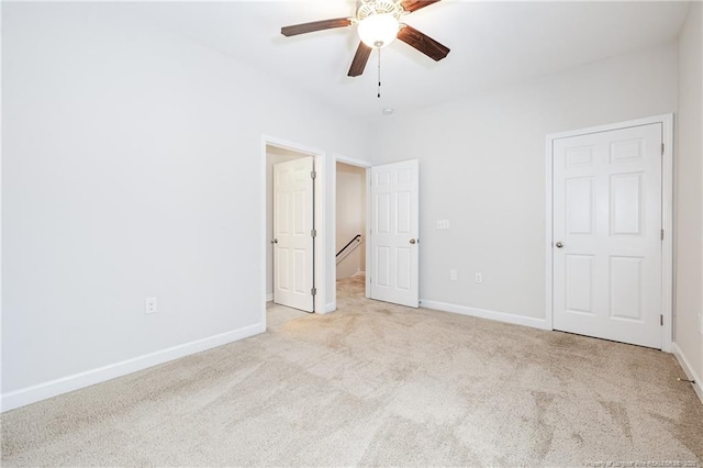 234 Hugh Shelton Loop, Fayetteville, NC 28301 - unfurnished bedroom with carpet floors, baseboards, and a ceiling fan