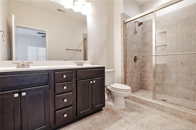 234 Hugh Shelton Loop, Fayetteville, NC 28301 - bathroom featuring a stall shower, double vanity, toilet, and tile patterned flooring