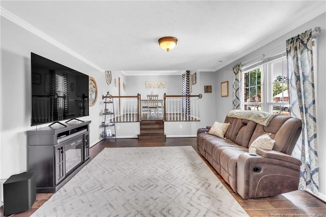 living room featuring baseboards, dark wood-style flooring, stairs, and crown molding
