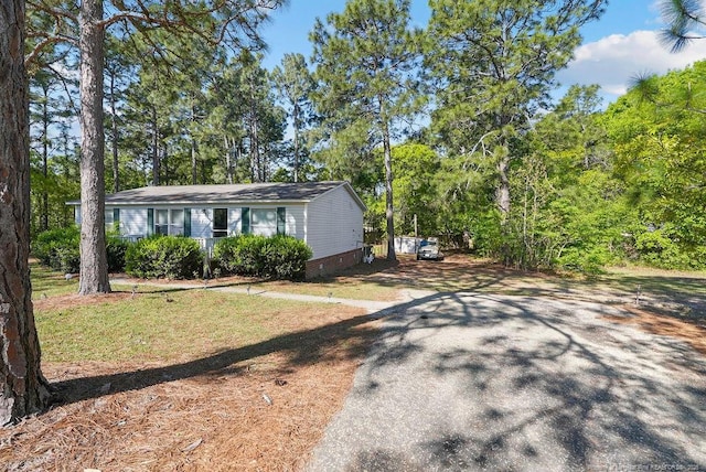 exterior space with driveway and crawl space