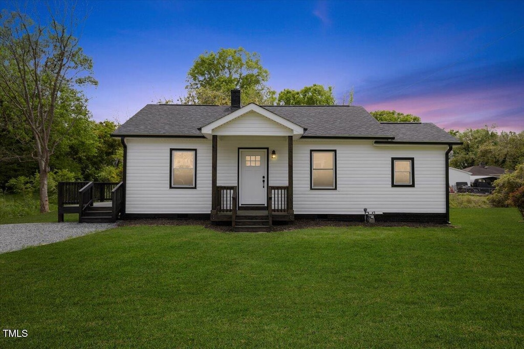 326 W Gilbreath St, Graham, NC 27253 - bungalow featuring a lawn, a wooden deck, and a shingled roof