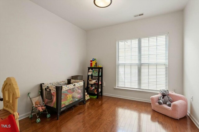 803 Footbridge Pl, Cary, NC 27519 - recreation room featuring baseboards, wood finished floors, and visible vents