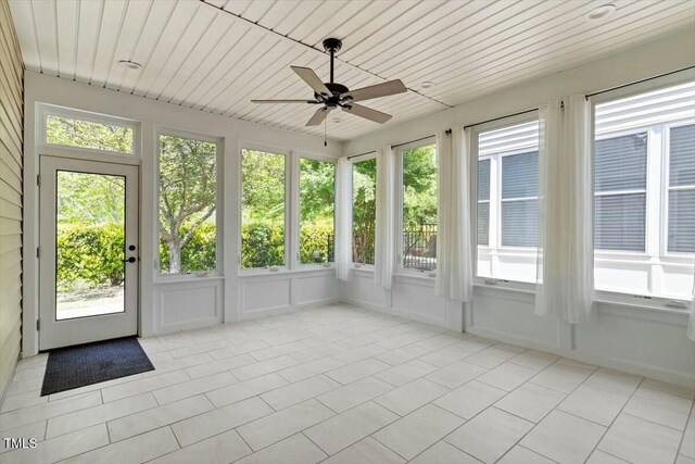 803 Footbridge Pl, Cary, NC 27519 - unfurnished sunroom with tile patterned floors and a decorative wall