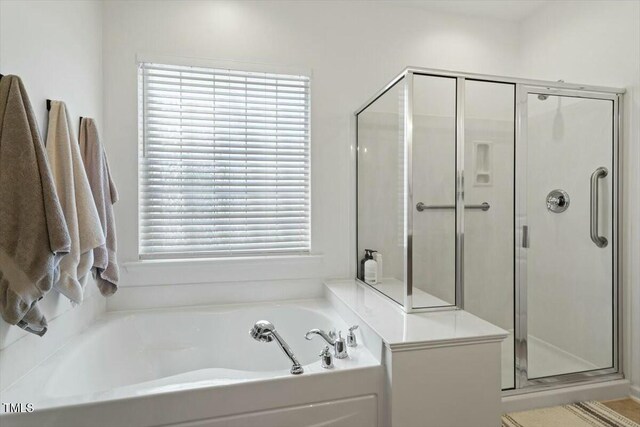 803 Footbridge Pl, Cary, NC 27519 - full bathroom featuring a bath, a wealth of natural light, and a stall shower