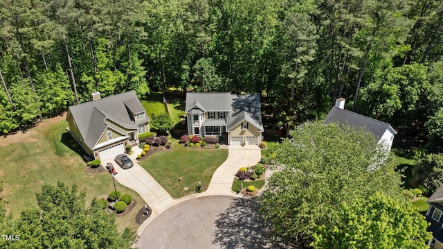 drone / aerial view featuring a view of trees