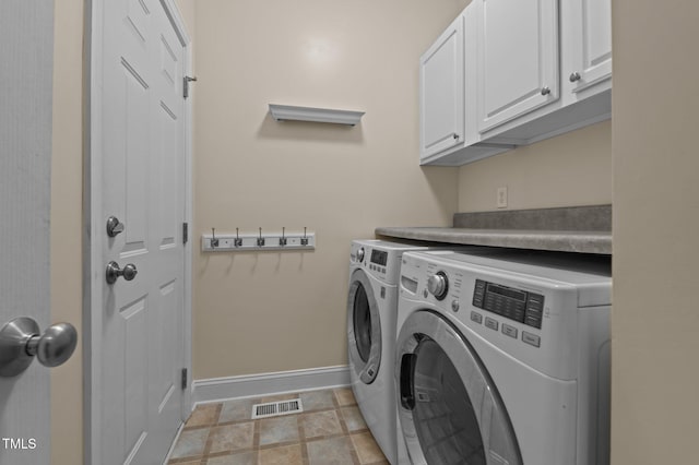 laundry room with baseboards, cabinet space, independent washer and dryer, and visible vents