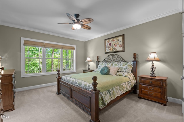 bedroom with baseboards, light colored carpet, ornamental molding, and ceiling fan
