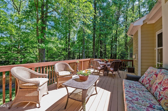 deck featuring outdoor dining area
