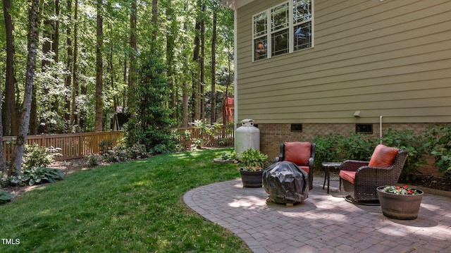 view of yard with a patio and fence