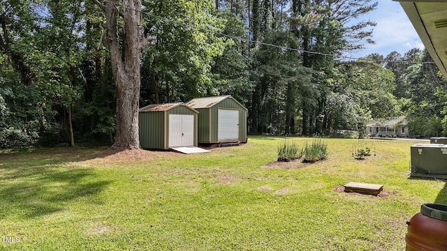 view of green lawn featuring a storage unit and an outdoor structure