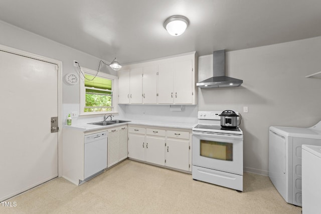 kitchen with white appliances, independent washer and dryer, wall chimney exhaust hood, a sink, and light countertops