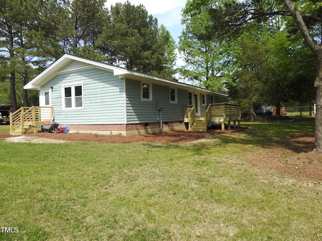 1165 John Mitchell Rd, Youngsville, NC 27596 - rear view of property featuring a lawn, crawl space, and a deck