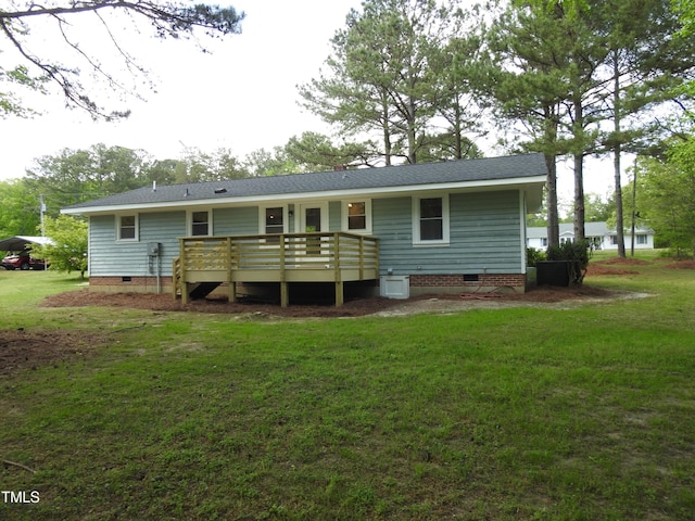 1165 John Mitchell Rd, Youngsville, NC 27596 - back of property with a shingled roof, a wooden deck, a yard, and crawl space