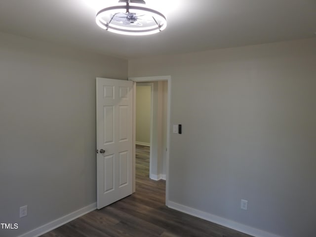 1165 John Mitchell Rd, Youngsville, NC 27596 - unfurnished room with baseboards and dark wood-style floors