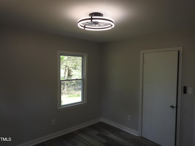 1165 John Mitchell Rd, Youngsville, NC 27596 - empty room featuring baseboards, a healthy amount of sunlight, and dark wood-type flooring