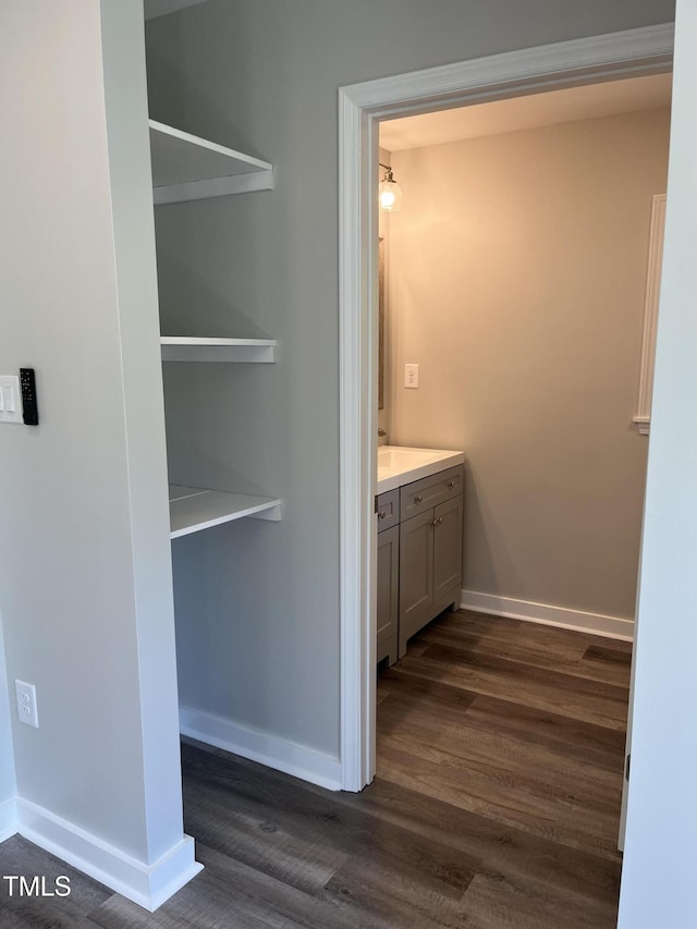 1165 John Mitchell Rd, Youngsville, NC 27596 - bathroom with vanity, baseboards, and wood finished floors
