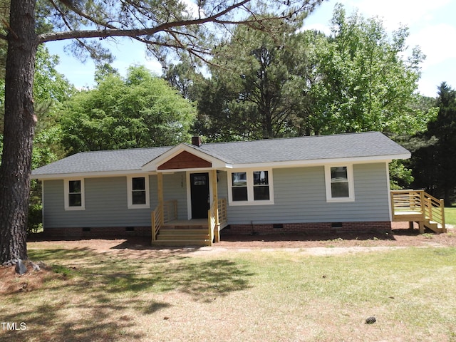 1165 John Mitchell Rd, Youngsville, NC 27596 - ranch-style house with crawl space, a shingled roof, and a front lawn