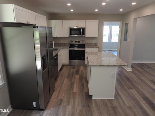 1165 John Mitchell Rd, Youngsville, NC 27596 - kitchen featuring light stone countertops, baseboards, recessed lighting, a center island, and stainless steel appliances
