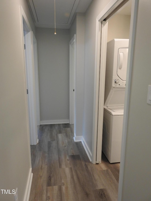1165 John Mitchell Rd, Youngsville, NC 27596 - hall with baseboards, stacked washer and clothes dryer, wood finished floors, and attic access