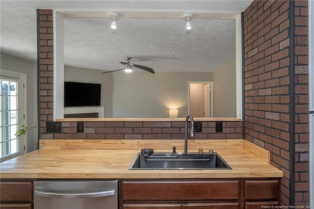 204 Bayfield Loop, Fayetteville, NC 28314 - kitchen with wooden counters, dishwasher, a sink, a textured ceiling, and a ceiling fan