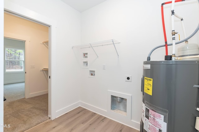 laundry room featuring water heater, light wood finished floors, laundry area, electric dryer hookup, and washer hookup