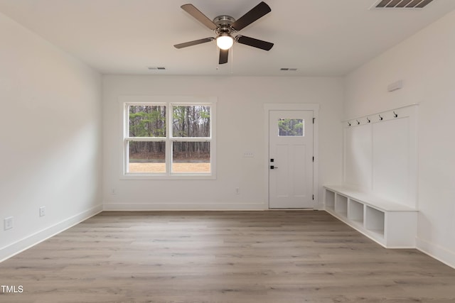 mudroom featuring baseboards, a ceiling fan, wood finished floors, and visible vents