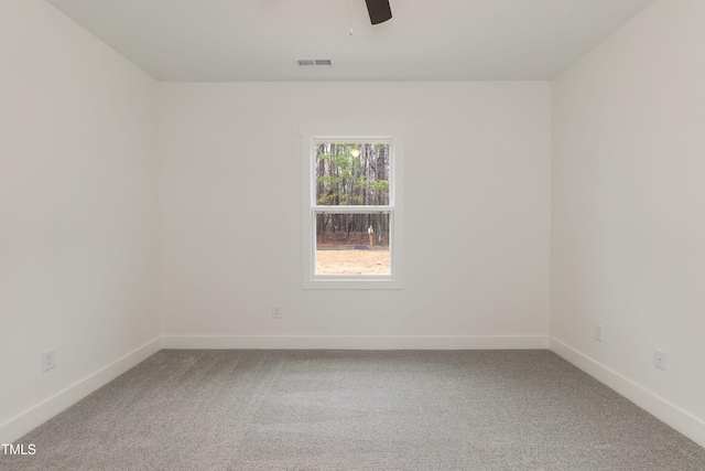 unfurnished room featuring ceiling fan, baseboards, and carpet