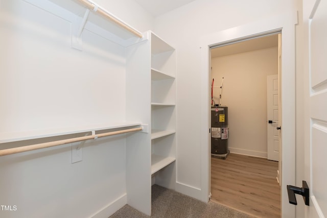 spacious closet featuring water heater