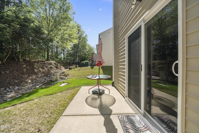 view of patio featuring fence