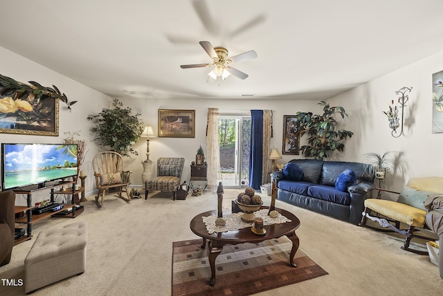living room featuring a ceiling fan and carpet flooring