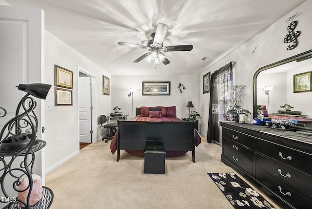 bedroom with ceiling fan, visible vents, baseboards, and light carpet