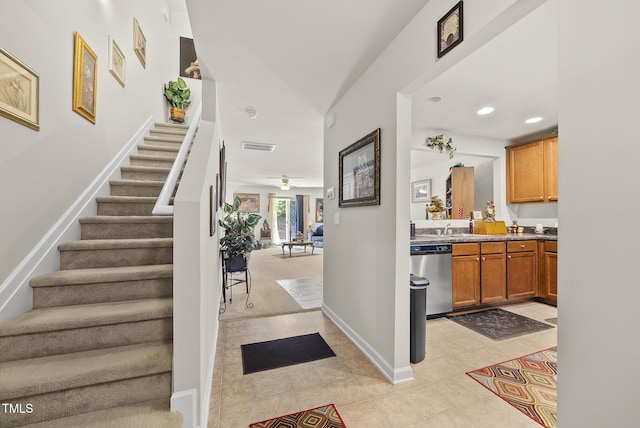 entrance foyer with baseboards, recessed lighting, a ceiling fan, stairs, and light tile patterned floors