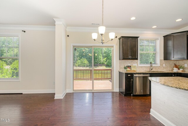 kitchen with a sink, plenty of natural light, dark brown cabinetry, and dishwasher