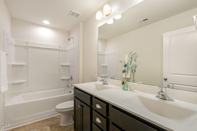 bathroom featuring toilet, visible vents, and a sink