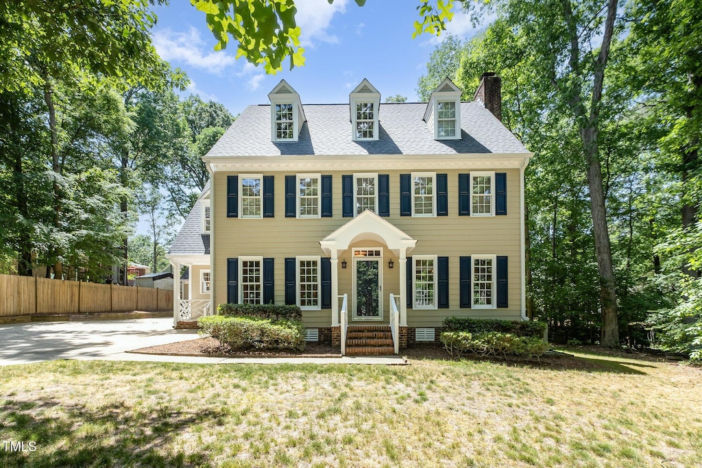 103 Donna Pl, Cary, NC 27513 - colonial inspired home with a chimney, crawl space, and driveway