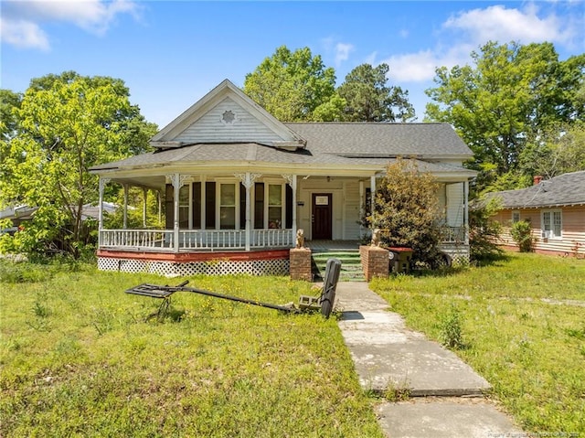 107 Church St, Red Springs, NC 28377 - view of front of property with a porch and a front yard