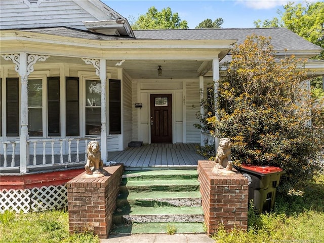 107 Church St, Red Springs, NC 28377 - doorway to property with a shingled roof and covered porch