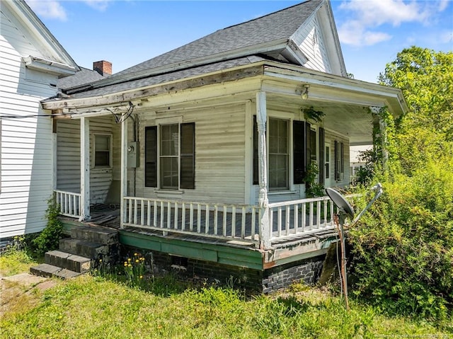 107 Church St, Red Springs, NC 28377 - exterior space featuring covered porch and roof with shingles