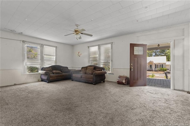 107 Church St, Red Springs, NC 28377 - living area featuring wainscoting, carpet flooring, and ceiling fan