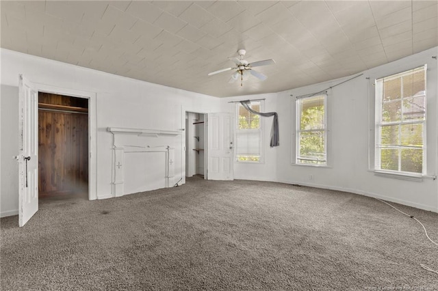 107 Church St, Red Springs, NC 28377 - unfurnished bedroom featuring multiple closets, baseboards, carpet floors, and ceiling fan