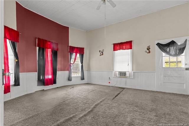 107 Church St, Red Springs, NC 28377 - unfurnished room featuring carpet, a wainscoted wall, and a ceiling fan