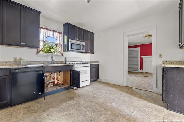 107 Church St, Red Springs, NC 28377 - kitchen with stainless steel microwave, white gas stove, black dishwasher, and a sink