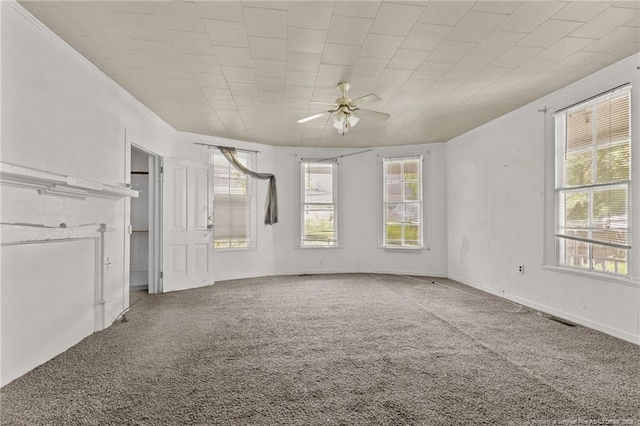 107 Church St, Red Springs, NC 28377 - unfurnished living room featuring carpet floors, a wealth of natural light, a ceiling fan, and visible vents