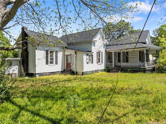 107 Church St, Red Springs, NC 28377 - view of front facade with a chimney, entry steps, and covered porch
