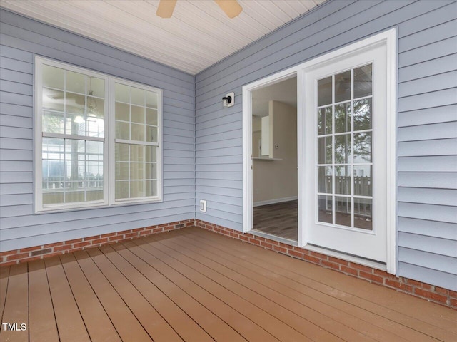 wooden terrace with a ceiling fan