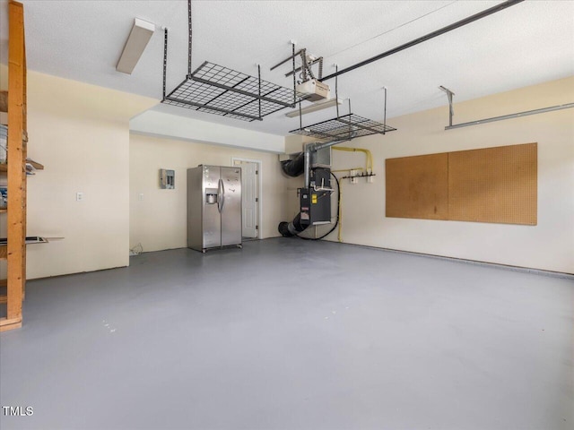garage featuring stainless steel fridge with ice dispenser, heating unit, and a garage door opener